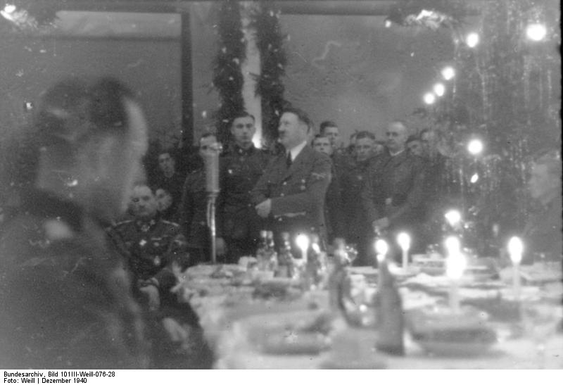 Adolf Hitler speaks at the Christmas dinner for the LSAH in Metz, France